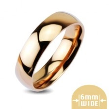 Rounded shiny metal wedding ring in pink and gold colour