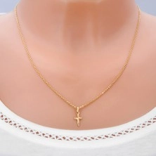 Gold pendant - cross with shiny rays on surface
