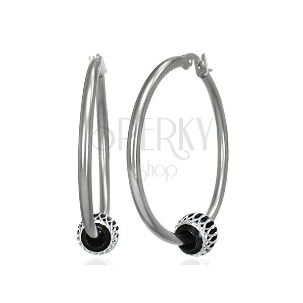 Steel earrings, circles with black ball with cutouts