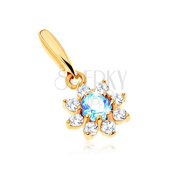 Pendant made of yellow 9K gold - flower with blue topaz, clear zircon petals