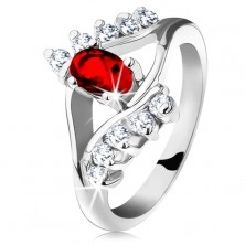 Glistening ring in silver hue, red cut oval, clear zircons