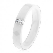White ceramic ring with smooth surface, steel rectangle with zircons