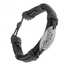 Bracelet made of black synthetic leather band and strings, shiny oval with lizard