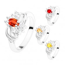 Ring in silver hue with smooth shiny arcs, coloured and clear zircons