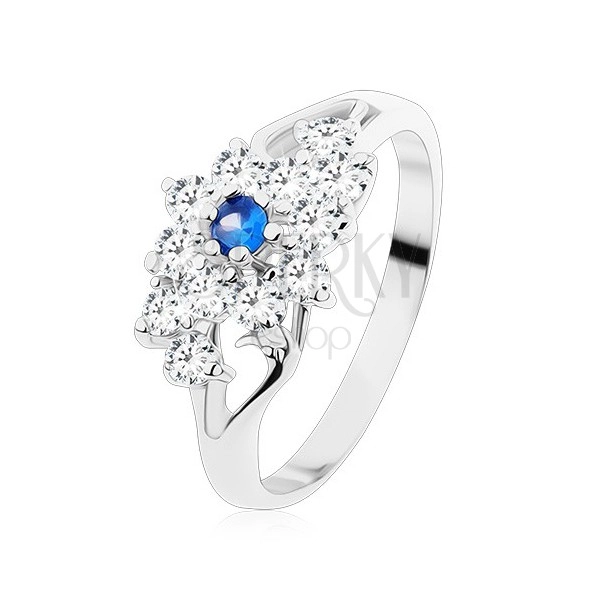 Ring with shiny split shoulders, clear flower with blue centre