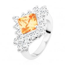 Ring in silver colour, light orange square zircon, round clear zircons