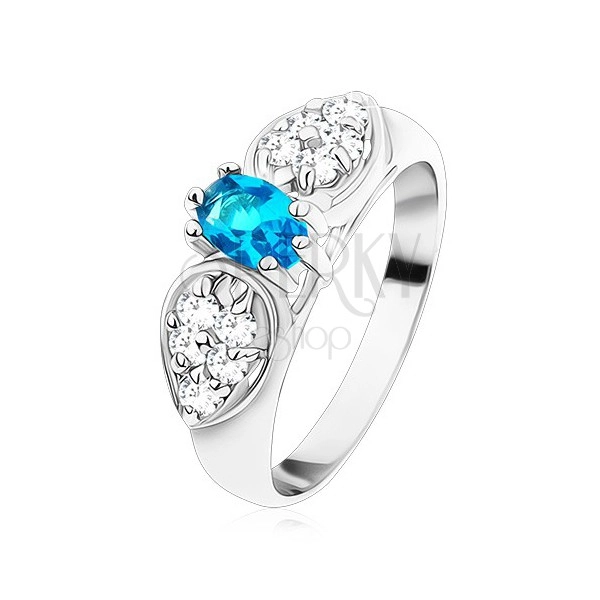 Shiny ring in silver colour, glossy bow with blue oval