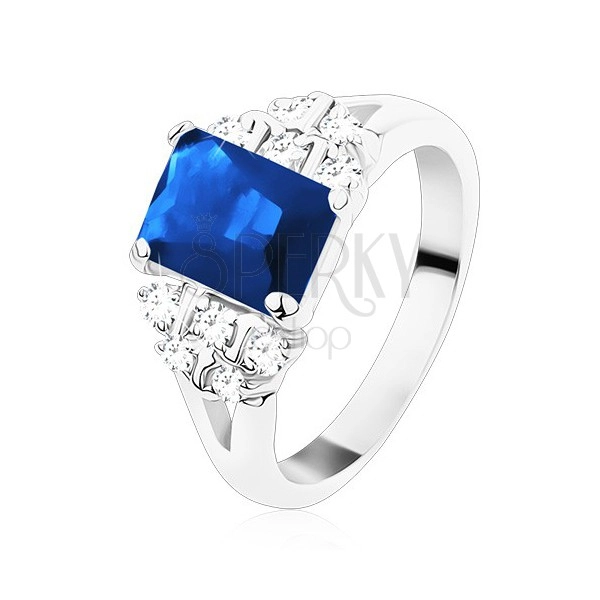 Ring in silver hue, dark blue zircon oblong, clear zircons