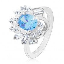 Ring in silver colour, big oval zircon, round and oblong zircons
