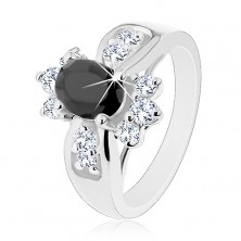Shiny ring with widened shoulders, coloured oval zircon, round clear zircons