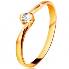 Ring made of yellow 14K gold - clear diamond between bent ends of shoulders