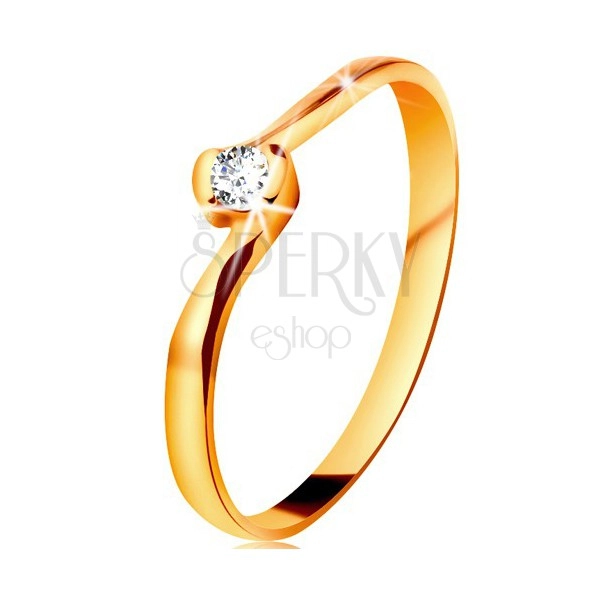 Ring made of yellow 14K gold - clear diamond between bent ends of shoulders