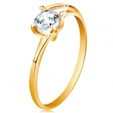 Ring made of yellow 14K gold - thin divided lines of shoulders, sparkly clear zircon