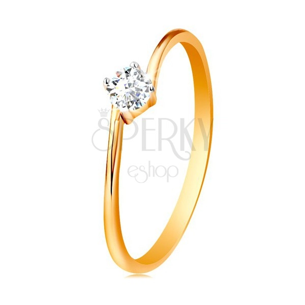 Ring made of yellow 14K gold - round clear zircon gripped between the ends of shoulders