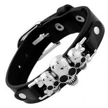 Black bracelet made of synthetic leather and steel, three skulls with crossbones