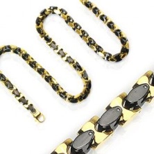 Steel chain, shiny oval links in gold and black colour