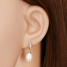 14K gold earrings - dangling oval pearl in white colour, zircon arc