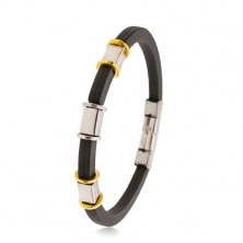 Black rubber bracelet with notches, steel decorations in silver and gold colour