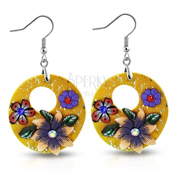 FIMO earrings, dangling orange circles with flowers and a round cut-out