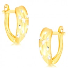 14K gold earrings – atypical arch with notches and cross lines of white gold