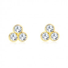 Yellow studs made of 585 gold - trefoil with glittery zircons