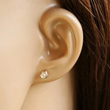 Yellow 14K gold studs - flower and clear zircon placed in the center embedded within