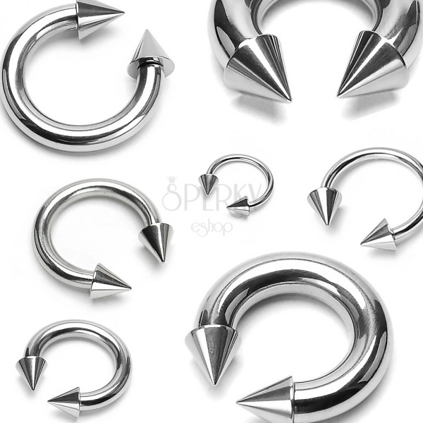 Stainless steel piercing of silver color - horseshoe finished with pikes