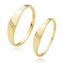 14K yellow gold bands - three clear brilliants in diagonal notch