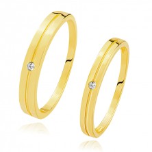 Bands in 585 yellow gold - round clear zircon in the central notch