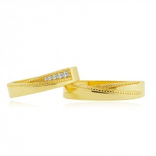 Bands in 585 yellow gold - triangular notch lined with dots, clear zircons