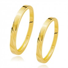 Wedding bands in 585 yellow gold - wavy diagonal notches, dent