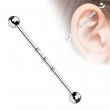 Industrial piercing with three small rings and ball heads