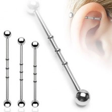 Industrial piercing with three small rings and ball heads