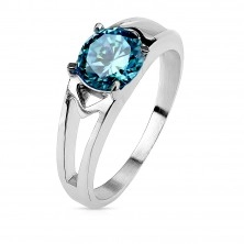 Steel ring with decorative cuts and zircon