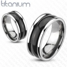 Titanium ring with protruding edges and rounded black centre
