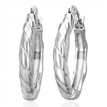 Round intertwined earrings made of surgical steel, silver colour