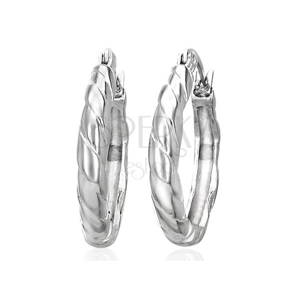 Round intertwined earrings made of surgical steel, silver colour